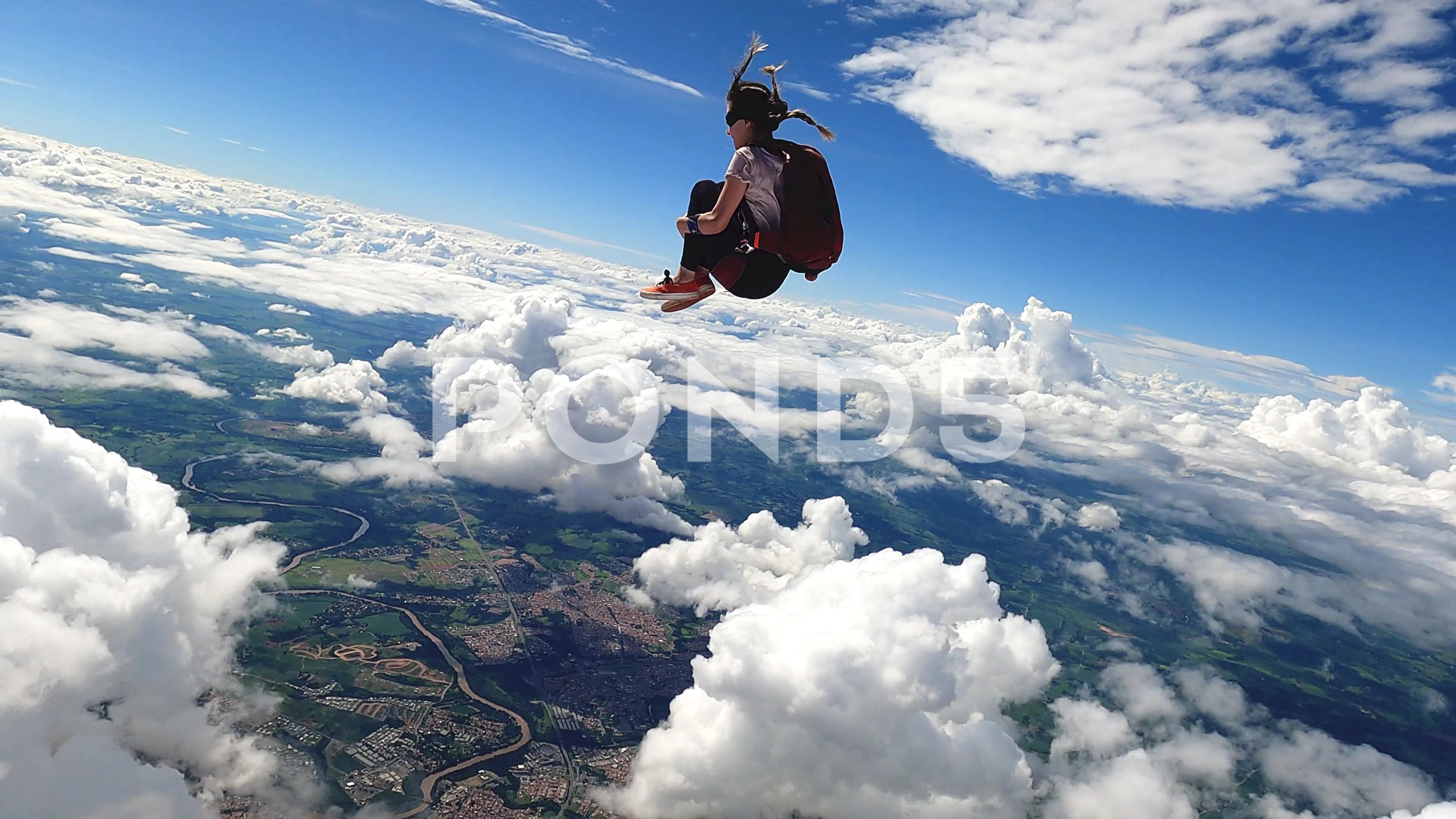 Video of a young woman skydiver jumping from the plane