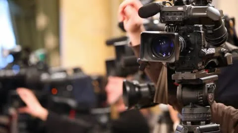 Videocamera and hands of operator, adjusting its close up Video stock 10681698