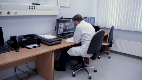 Videoconference of a doctor with colleagues. Stock Footage 129657201
