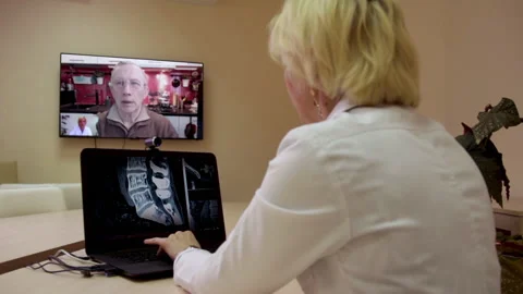 Videoconference of a physician with patient. Stock Footage 130492287