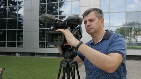 The videographer is busy with the shooting process. Creative profession operator Video stock 94817119