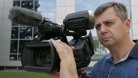 The videographer is busy with the shooting process. Creative profession Stock-Footage 94817168