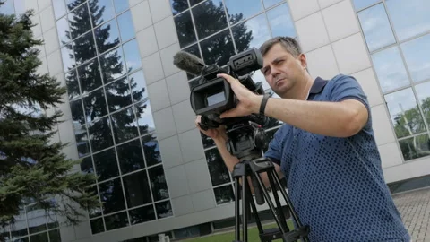 The videographer is busy with the shooting process. Creative profession Stock-Footage 94817345