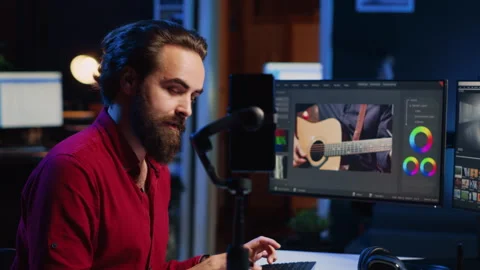 Videographer filming online tutorial with phone about utilizing editing software Stock Footage 257726338