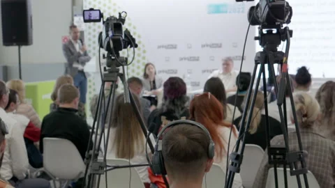 Videographer filming the speakers at a presentation. Stock Footage 199248569