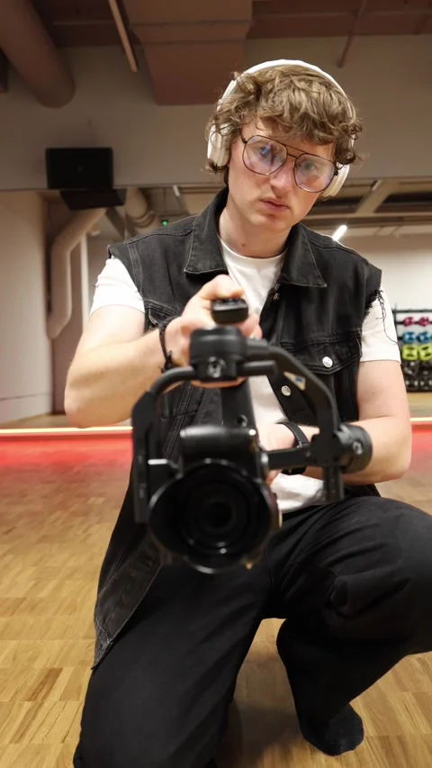 Videographer filming with stabilizer Stock Footage 332116789