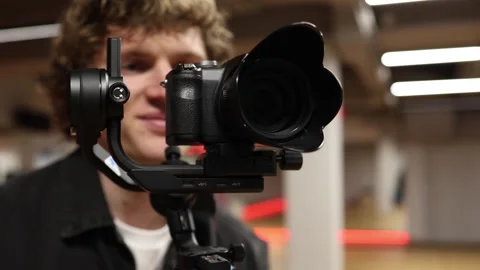 Videographer filming with stabilizer Stock Footage 332902289