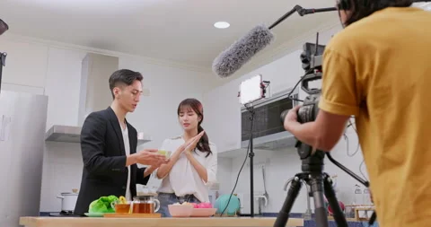 Videographer filming video Video stock 227655225