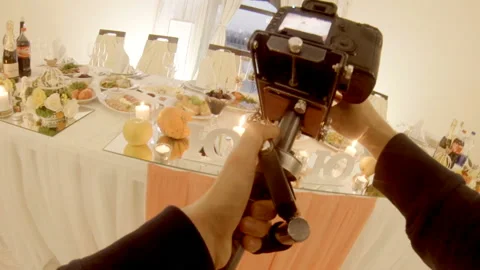 Videographer filming a wedding table in a restaurant Stock Footage 115031945
