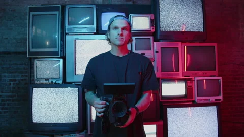 Videographer Getting Shot In Front Of Static TV's Vídeo Stock 270332526