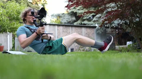 Videographer holding static core position Stock Footage 336791402