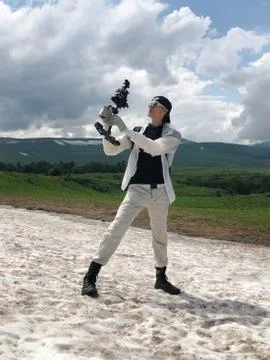 Videographer holding steadicam Stock Photos