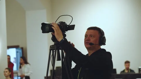 Videographer, online broadcast operator, man with a video camera Stock Footage 310892379