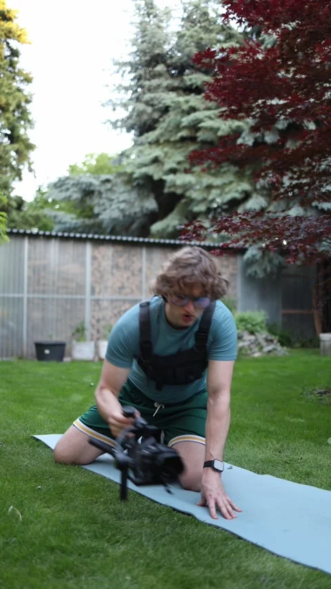 Videographer practicing controlled gimbal movements outdoors Stock Footage 336370245