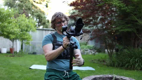 Videographer practicing gimbal control Stock Footage 336790261