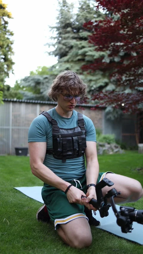 Videographer practicing one hand gimbal control outdoors Stock Footage 336370892