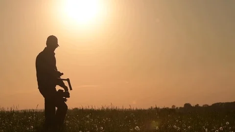 Videographer with Professional Gimbal Video Camera Stabilizing Equipment. Stock Footage 90339357