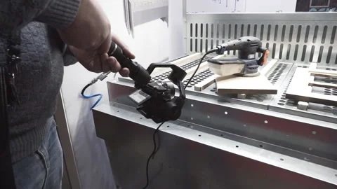 A videographer with a stabilizer and a camera shoots industrial equipment. Stock Footage 121969495