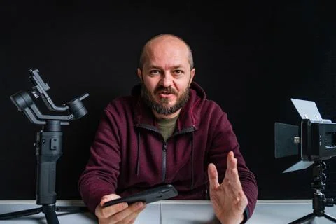 Videographer in studio vlogging about making videos Stock Photos