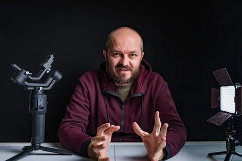 Videographer in studio vlogging about making videos Stock Photos