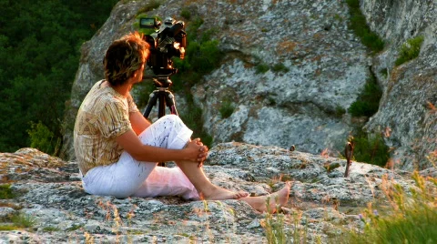 Videographer on sunset mountain HD 2 Stock Footage 478582