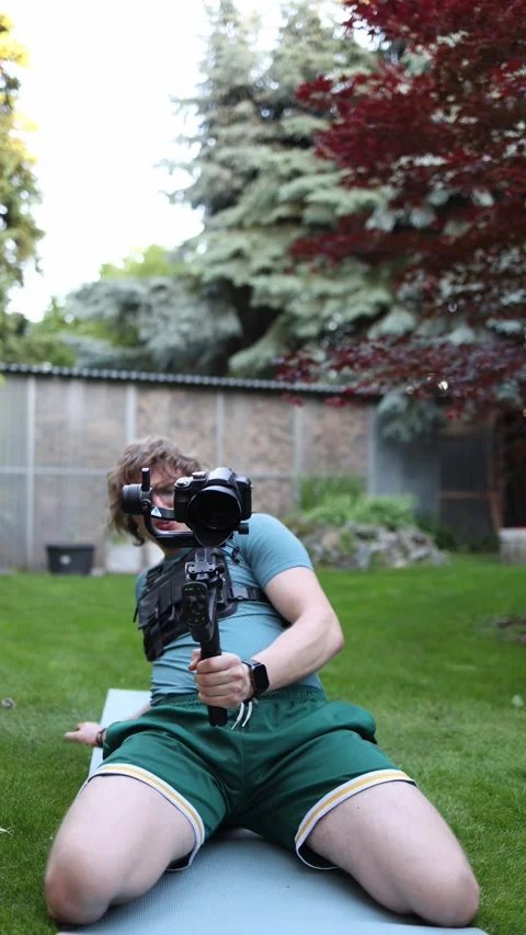Videographer trains with camera rig Stock Footage 336368788