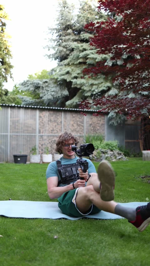 Videographer trains core with gimbal Stock Footage 336368862