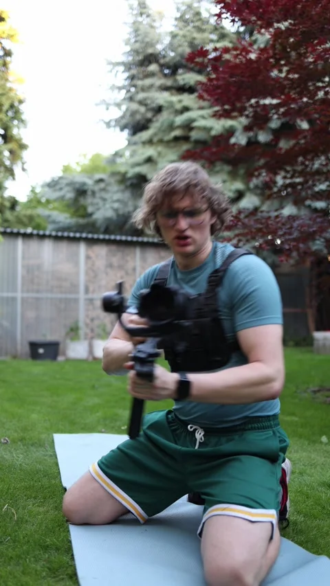 Videographer trains gimbal control with forward backward movement Stock Footage 336369316