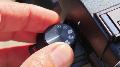 Videographer turning mode dial on professional video camera Stock Footage 312122625
