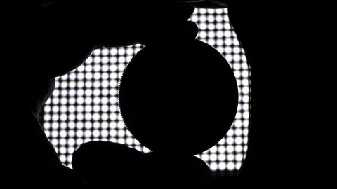 Videographer turning Neutral Density variable ND Filter. LED Light in background Stock-Footage 119164031