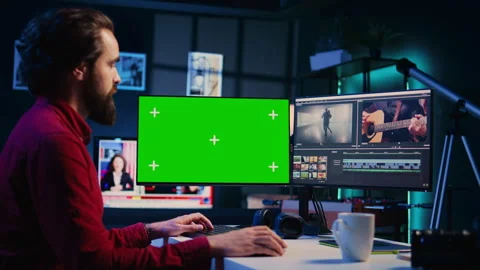 Videographer using professional software on mockup PC to create visual effects Stock Footage 260977359