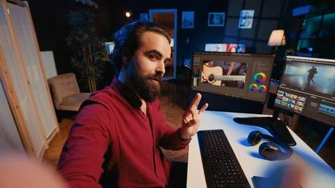 Videographer using selfie camera to record tutorial on how to use software to Stock Photos