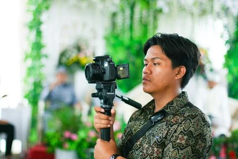 Videographer at wedding event Stock Photos