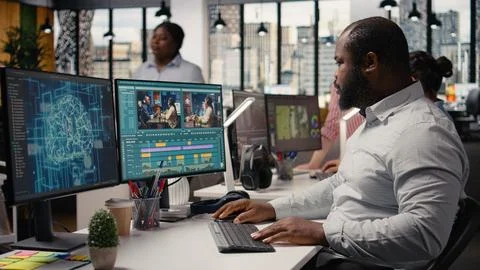 Videographers team using AI software tools for video editing on PC Stockfoto's