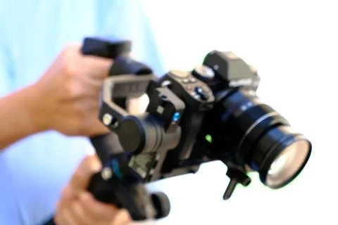 Videography, hobby and creativity concept with camera on gimbal Stock Photos