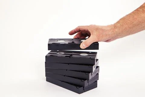 Videotapes are black without boxes in their hands on a white background Stockfoto's