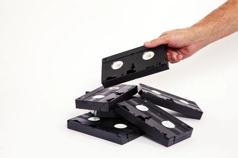 Videotapes are black without boxes in their hands on a white background Stock Photos