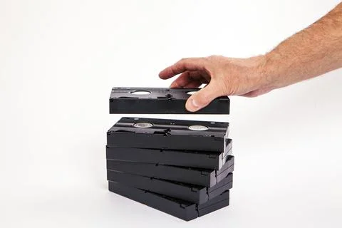 Videotapes are black without boxes in their hands on a white background Stockfoto's