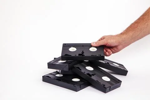 Videotapes are black without boxes in their hands on a white background Stock Photos