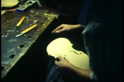 VIENNA, AUSTRIA, 1988, String instrument manufacturing, file top of violin 動画素材 10920926