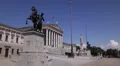 Vienna Austrian Parliament Establishing Shot Busy Street Sidewalk People Walking HD Footage