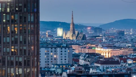 Vienna city skyline day to night time-lapse with Saint Stephen's Cathedral Stock Footage