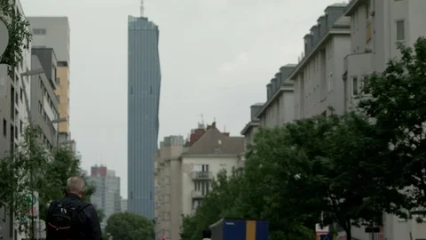 Vienna DC tower in the background of a road building line, sharpness relocation Vídeo Stock 82446370