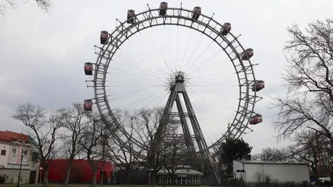 The Vienna Ferris Wheel with red gondolas on a cloudy day Video stock 305160430