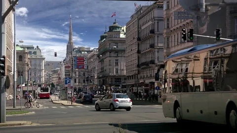 Vienna road alignment Stephansdom in the background II – long lens – SKY Stock Footage 74377089