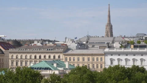 Vienna skyline through the trees with South Tower of St Stephen's Cathedral 스톡 동영상 285102734