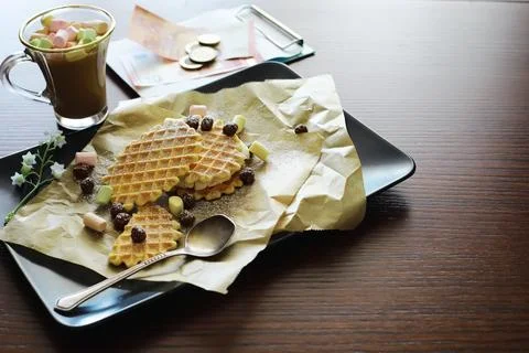 Viennese waffles with filling. Coffee table. A set of fragrant cookies for .. Stock Photos