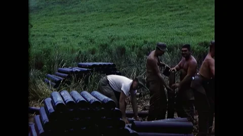 VIEQUES - 1952 - Tank crews stacking spent shell casings behind the firing line Video stock 312747933