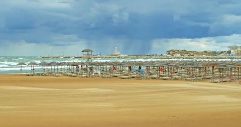 Vieste (Apulia) beach deserted due to the arrival of a storm. The beach umbre Stock-Footage 232239360