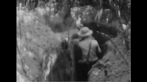Viet Cong leaving bunkers, moving through trenches - 1967 Stock Footage 103990822